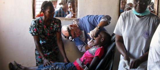 Dr. Murphy working with children